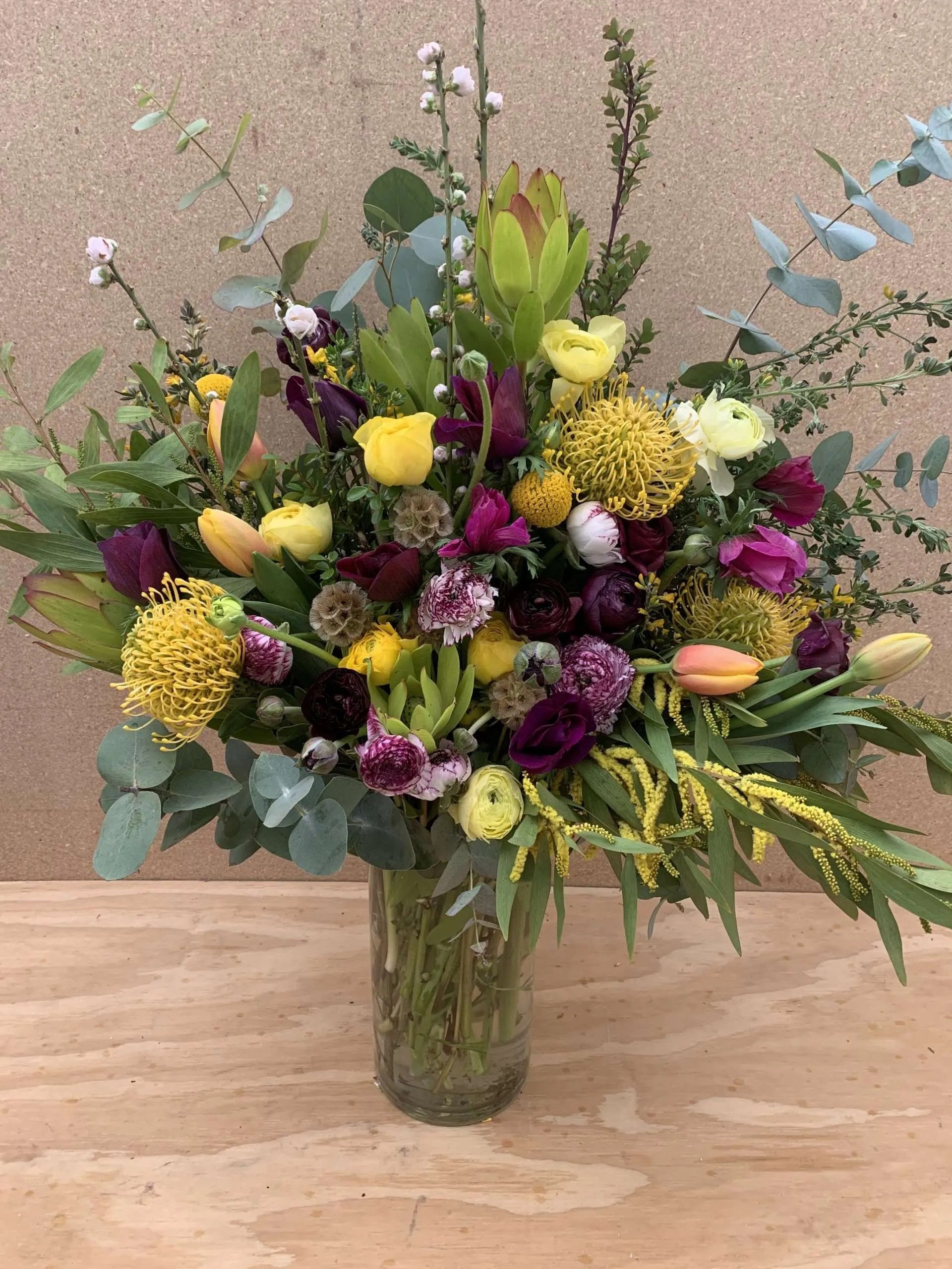 flower delivery in purples and yellows
