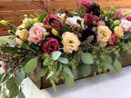 flower delivery centerpiece on table