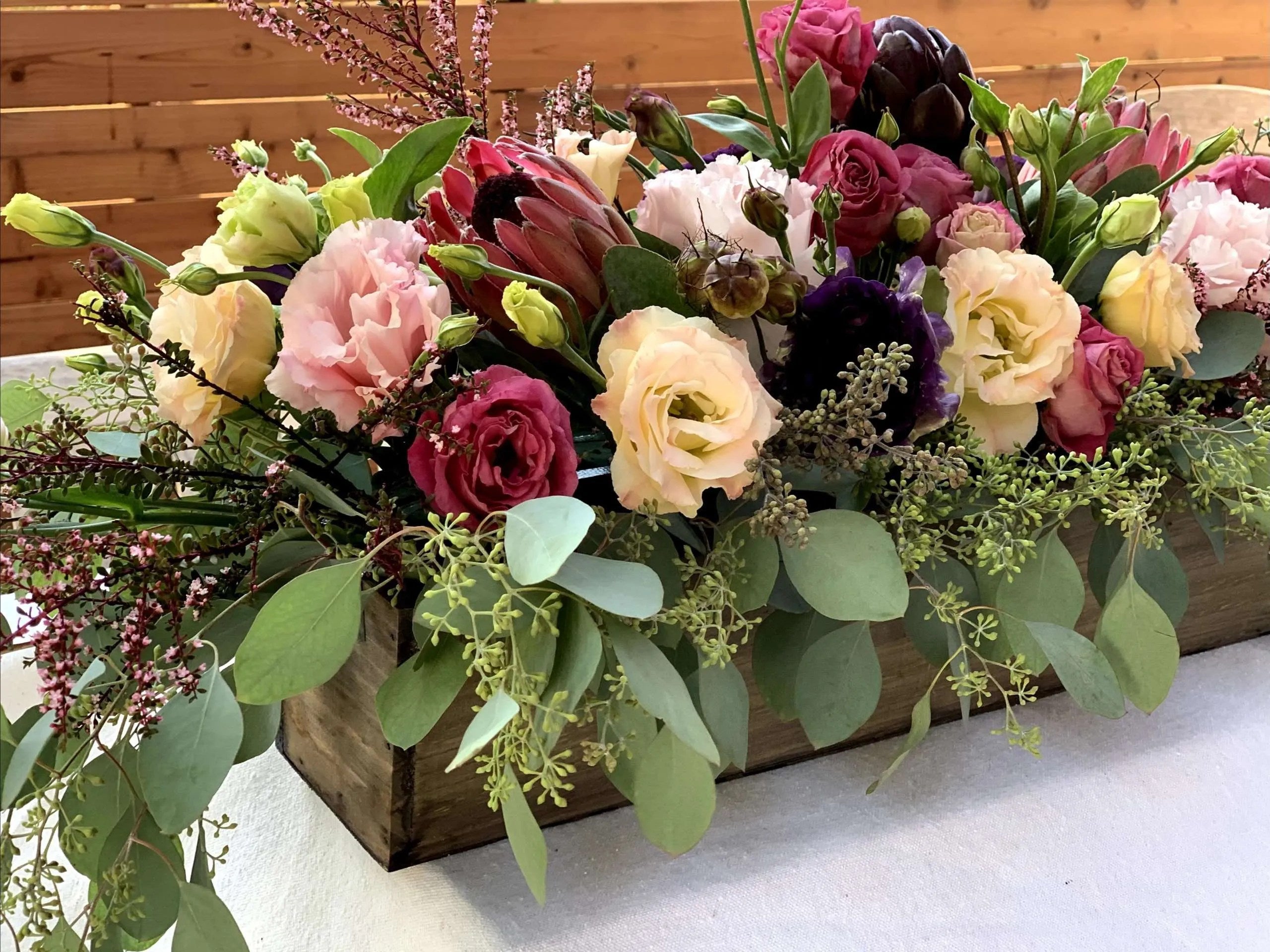 flower delivery centerpiece on table